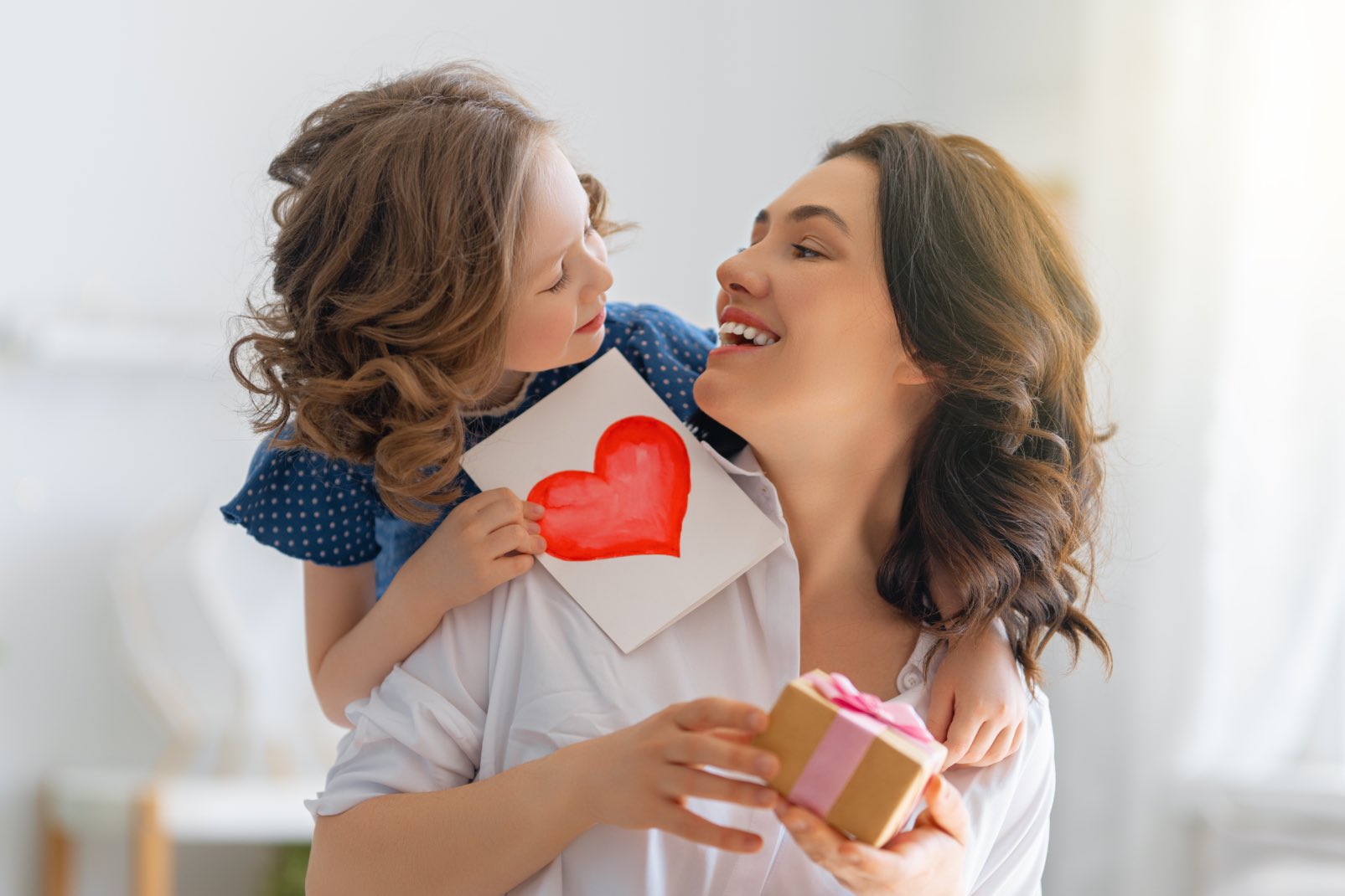 This mother receiving a card from her daughter and Zerorez cleaning services as a gift.